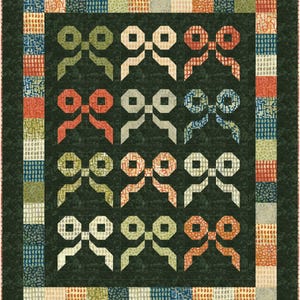 May include: A quilt with a dark green background and a repeating pattern of green, cream, and orange bows. The quilt is bordered with a multi-coloured patterned fabric.