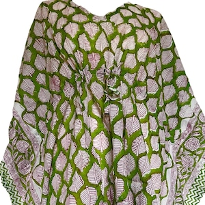 May include: Green and white cotton kaftan with a leaf print and a drawstring waist.