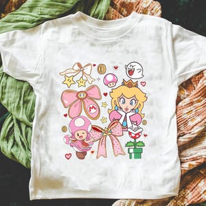 Koszulka Coquette Princess Peach: Koszulka podróżna dla dziewczyn Feeling Peachy