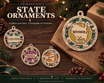 May include: Four circular wooden state ornaments featuring laser-cut designs. The ornaments display the names Pennsylvania, Tennessee, New York, and Wisconsin, each surrounded by iconic state-specific imagery and text engravings on the outer border.
