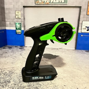 Rc transmitter thumb steer for one handed use. Radio Storage combo Radio Hanger