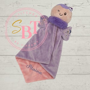 May include: Purple and pink baby security blanket with a butterfly plush toy attached. The blanket has the name "Alaina" embroidered on it.