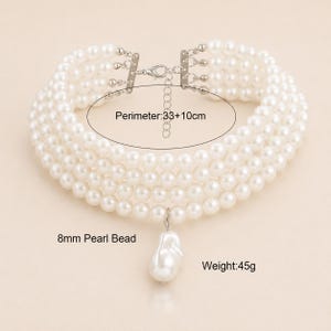 May include: A multi-strand pearl choker necklace with a large baroque pearl pendant. The necklace has a perimeter of 33+10cm and weighs 45g. The pearl beads are 8mm in size. The necklace has a silver-tone clasp.