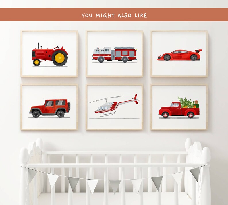 May include: Six framed prints of red vehicles, including a tractor, fire truck, sports car, jeep, helicopter, and pickup truck. The prints are displayed on a white wall above a white crib.