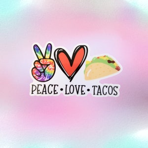 May include: A white sticker with a peace sign, a heart, and a taco. The text "Peace Love Tacos" is written below the images.