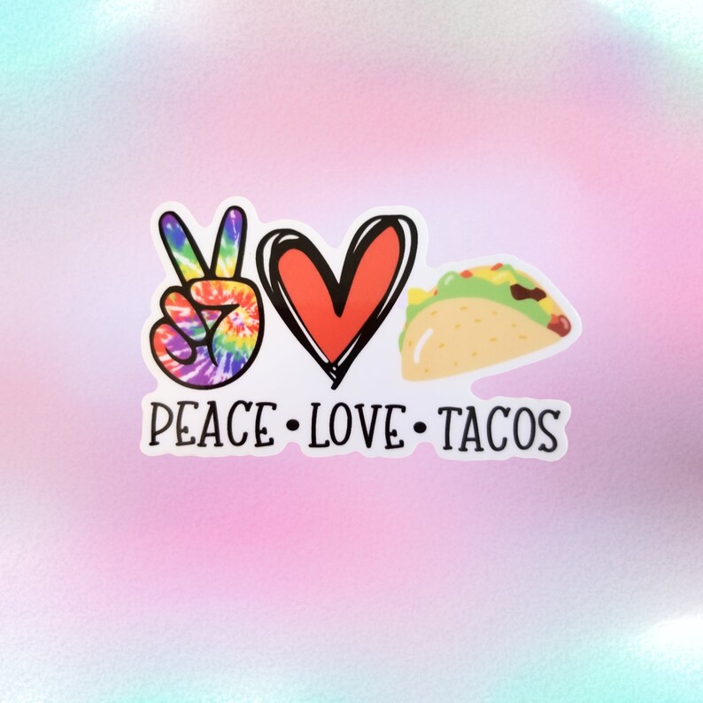 May include: A white sticker with a peace sign, a heart, and a taco. The text "Peace Love Tacos" is written below the images.