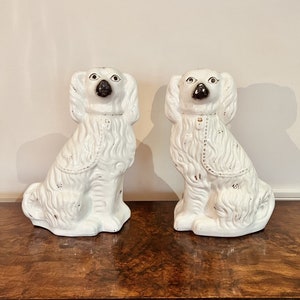 Large pair of Victorian seated Staffordshire spaniel dogs