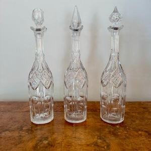 Unusual trio of antique Edwardian cut glass decanters