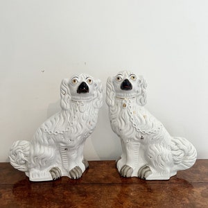 Large pair of Victorian seated Staffordshire spaniel dogs