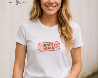 Jesus Heals Floral Bandage Tee – Vintage-Inspired Christian Graphic Shirt, Faith-Based Apparel