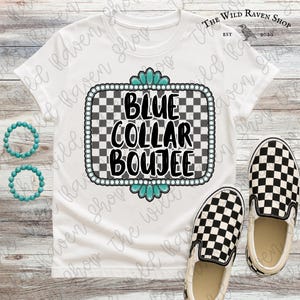May include: White t-shirt with a graphic that says "BLUE COLLAR BOUJEE" in black letters. The graphic is framed with a turquoise and pearl-like border. The shirt is paired with black and white checkered slip-on shoes.