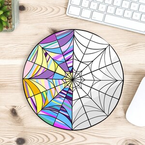 May include: A round, colorful mandala design with a spiderweb pattern on the right half. The mandala features a variety of colors, including purple, pink, blue, yellow, and white.