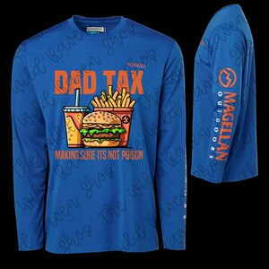 May include: Blue long-sleeve shirt with the text "DAD TAX" above a graphic of a burger, fries, and a drink. The text "MAKING SURE ITS NOT POISON" is below the graphic. The sleeve has the "Magellan Outdoors" logo.