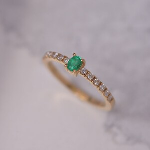 Oval Cut Natural Colombian Emerald stackable band in 14k Yellow Gold with 12 brilliant round diamonds