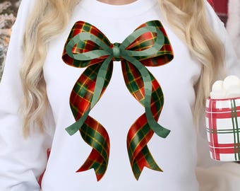 Op de afbeelding: Witte sweatshirt met een grote strik-afbeelding. De strik heeft een rood-groen ruitpatroon met groene lintaccenten. Een feestelijk ontwerp met een vakantiethema.