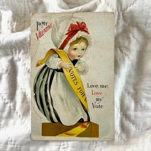 Vintage 1920's Valentine Postcard with Suffragette wearing a sash that reads, "Votes for Women".