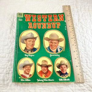 May include: A vintage Dell comic book cover featuring Western Roundup, a collection of Western stars. The cover features Roy Rogers, Gene Autry, Rex Allen, Johnny Mac Brown, and Bill Elliott. The comic book is green and red with a price of 25 cents.