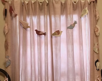 Bird garland hand crafted from various cardstock papers and feathers to hang over doorway, window, mantle and other locations.