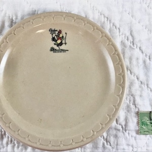 Vintage 1940&#39;s &quot;Chicken in the Rough&quot; Restaurant China Pie Plate measuring 5-1/2&quot; with  rooster logo holding a golf club on front of plate.