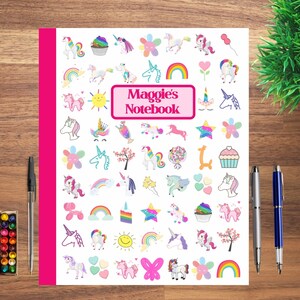 May include: A white notebook cover with a pink border and the text "Maggie's Notebook" in a pink rectangle. The cover is decorated with a variety of colorful unicorn-themed illustrations, including rainbows, stars, flowers, cupcakes, and hearts.