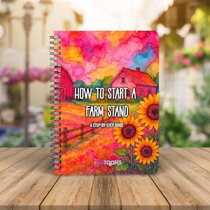 Puede incluir: Un cuaderno con espiral con una colorida ilustraci&oacute;n de acuarela. La portada presenta el texto "HOW TO START A FARM STAND" y "A STEP-BY-STEP GUIDE". La obra de arte representa una escena de granja con un granero rojo, girasoles y un campo.