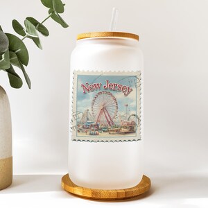 a vase with a plant in it next to a new jersey jar