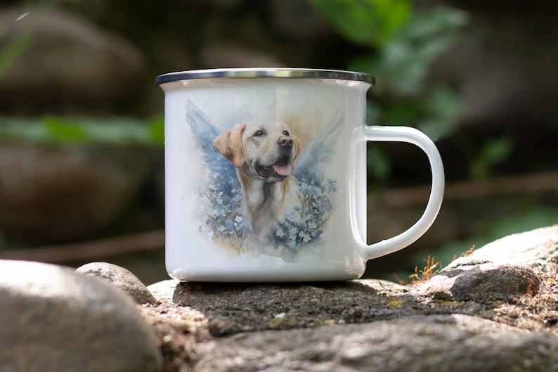 A white ceramic mug with a printed image of a dog, possibly a golden retriever, sitting on a rock in a natural outdoor setting.