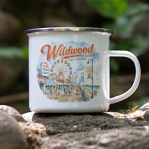 A white ceramic mug with a printed design depicting a carnival scene in New Jersey.