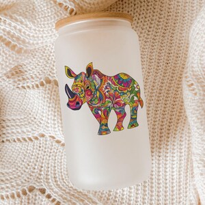 a white can with a picture of a rhino on it