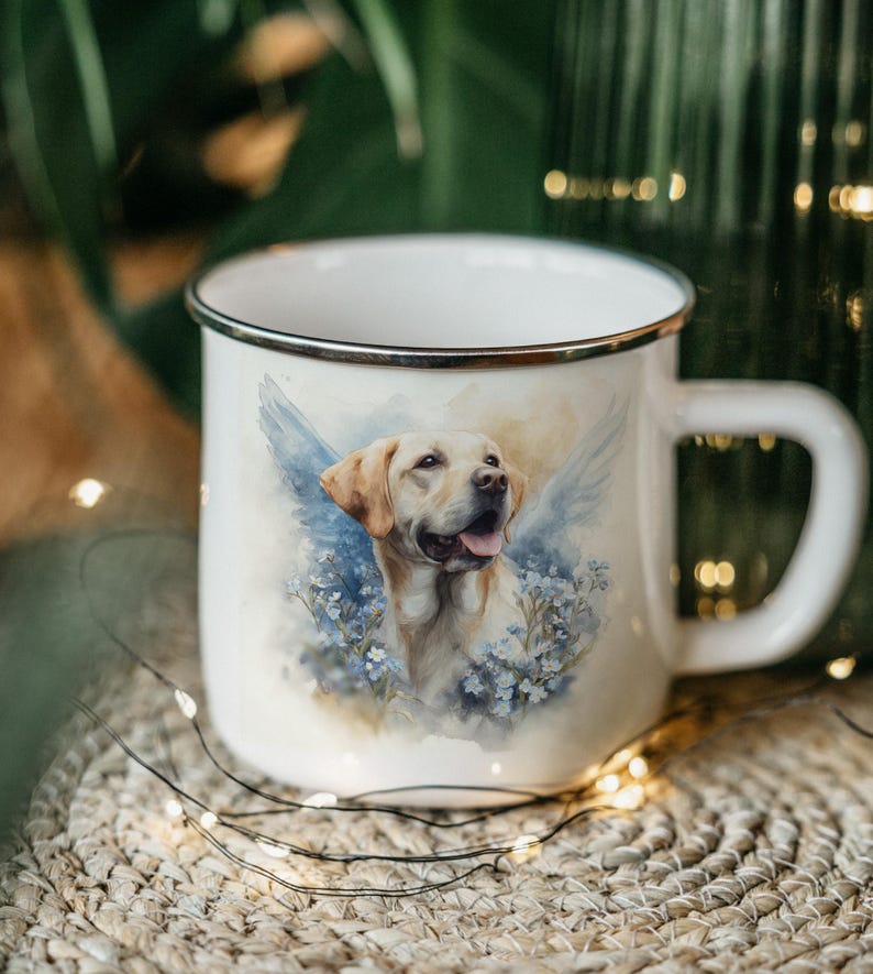 A white ceramic mug with a printed image of a dog, surrounded by flowers, is placed on a woven mat with twinkling lights in the background.