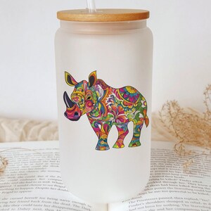 a glass with a picture of a rhino on it