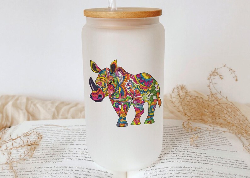 a glass with a picture of a rhino on it