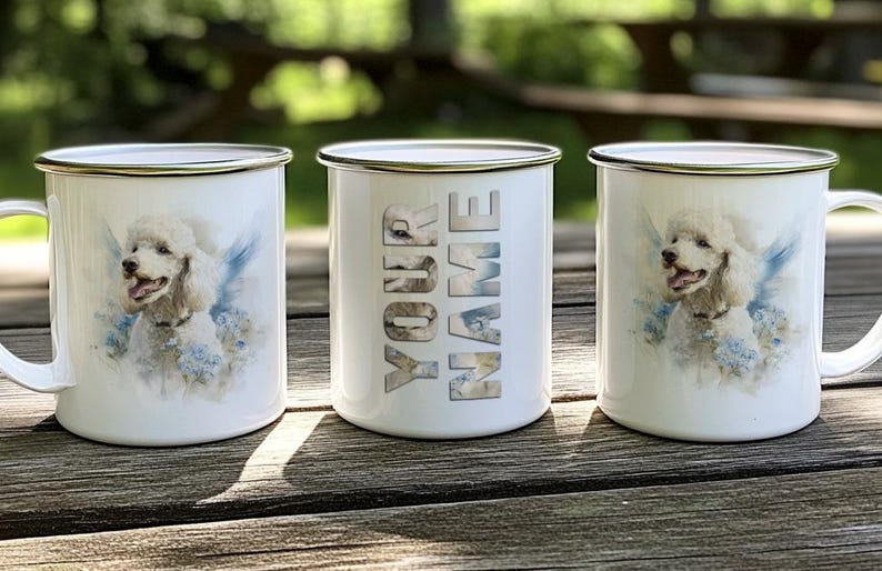 Three white ceramic mugs with images of poodles on them, placed on a wooden surface.