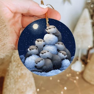 Otter Snowman Ornament – Stacking Otters with Snowy Shells by Moonlight – Winter Ceramic Animal Decoration