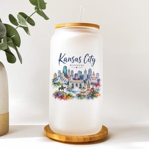 A white ceramic mug with a printed design of a cityscape and text that says "KANSAS CITY MISSOURI".