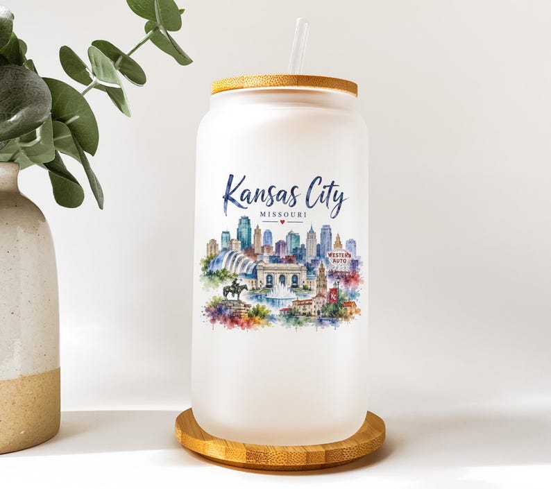 A white ceramic mug with a printed design of a cityscape and text that says "KANSAS CITY MISSOURI".