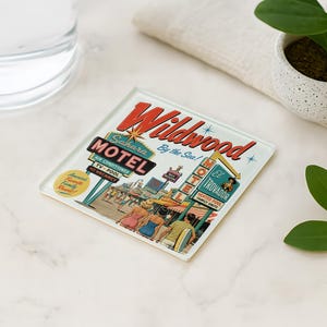 a coaster with a vintage-style illustration of the Wildwood Motel, surrounded by various objects such as a glass of water, a potted plant, and a leaf.