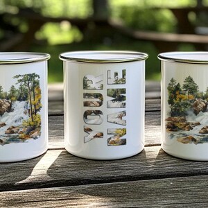 three coffee mugs sitting on top of a wooden table