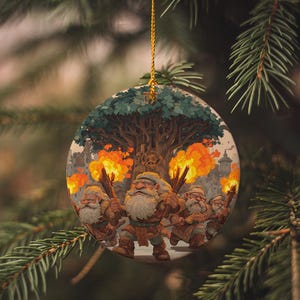May include: A round Christmas ornament featuring a fantasy scene with dwarves, torches, and a large tree. The dwarves are depicted with white beards and holding torches, with flames and a castle in the background. The ornament hangs from a gold string.