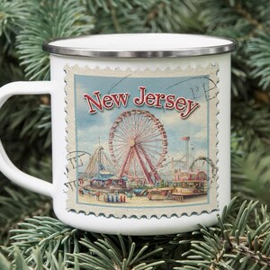 a white mug with a picture of a ferris wheel on it