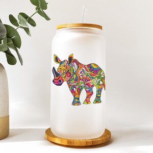 a glass jar with a picture of a rhino on it