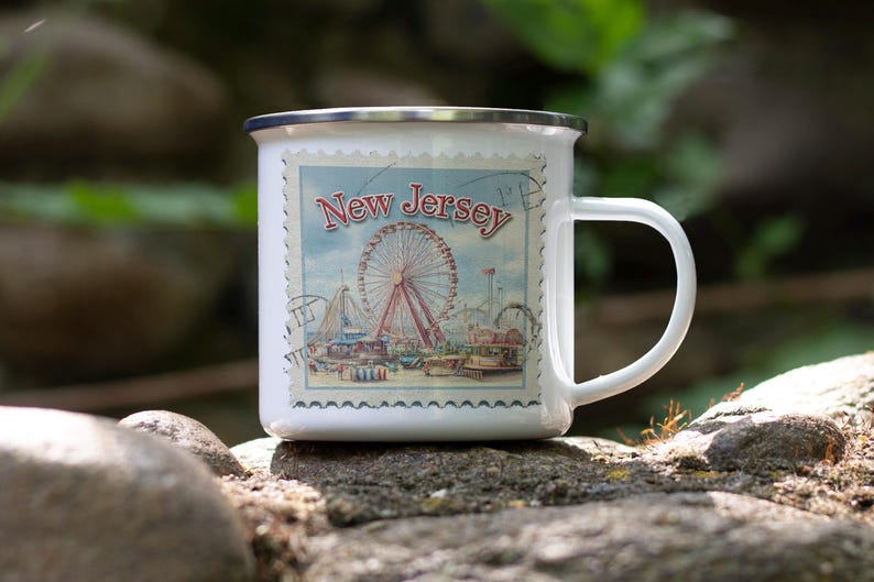 a white coffee mug with a picture of a ferris wheel on it