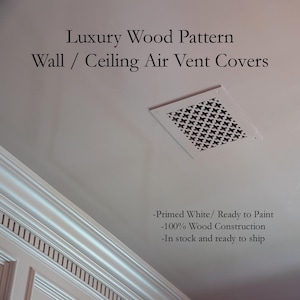 May include: A square white wooden air vent cover with a decorative lattice pattern installed on a ceiling. The text reads: Luxury Wood Pattern Wall / Ceiling Air Vent Covers, Primed White/ Ready to Paint, 100% Wood Construction, In stock and ready to ship.