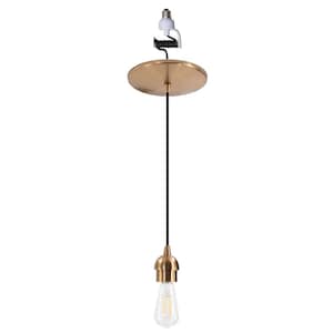 May include: A pendant light fixture featuring a circular brushed gold ceiling canopy, a black fabric cord, and a matching gold socket cover. The fixture includes a clear glass Edison-style light bulb and a white screw-in adapter at the top.