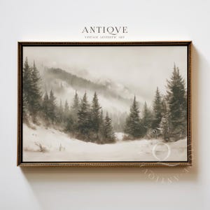 May include: Vintage aesthetic art print of a snowy mountain landscape. The sepia-toned artwork features evergreen trees, a snow-covered ground, and a misty sky. The framed print has a gold-colored ornate frame. The text "ANTIOVE VINTAGE AESTHETIC ART" is at the top.