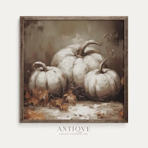 May include: A framed painting featuring three white pumpkins with curved stems, set against a muted background. Fallen leaves are scattered around the pumpkins, and the artwork has a vintage aesthetic. The text "ANTIQVE" and "VINTAGE AESTHETIC ART" are at the bottom.