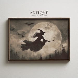 May include: A framed vintage aesthetic art print featuring a silhouetted witch flying on a broomstick in front of a full moon. Bats fly in the sky above a forest. The text "ANTIOVE VINTAGE AESTHETIC ART" is at the top.