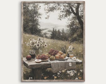 May include: A vintage-style framed print of a picnic scene. A wooden table is laden with fruit, flowers, and a checkered cloth. The background depicts a meadow and distant hills. The text "ANTIQVE" and "VINTAGE AESTHETIC ART" are at the bottom.