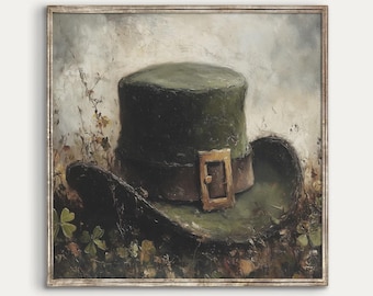 May include: A green felt top hat with a brown leather band and a gold buckle. The hat is lying on a bed of green leaves and flowers.