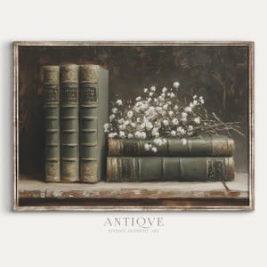 May include: A painting of a still life with a stack of old books and a bouquet of white flowers. The books are bound in green leather and have gold lettering on the spines. The flowers are arranged in a loose, natural way and are spilling over the top of the books.